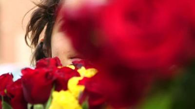 Syrian refugee children on the streets of Lebanon selling flowers