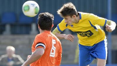 Match action from Bangor against Harland & Wolff Welders in Championship One