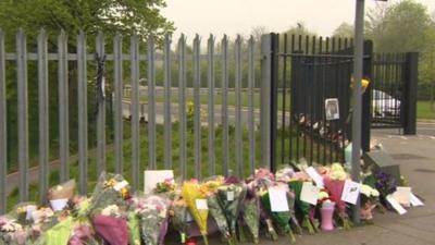 Floral tributes outside the school gates