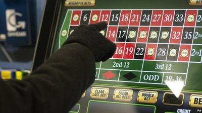 Person on a betting machine