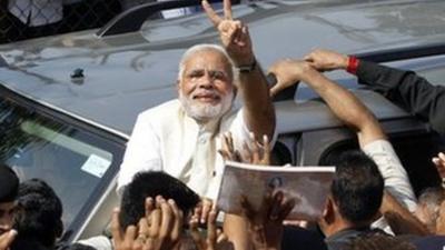 Narendra Modi surrounded by supporters