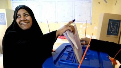 woman votes in Baghdad