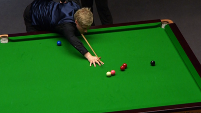 World number one Neil Robertson uses a trick shot to escape a snooker