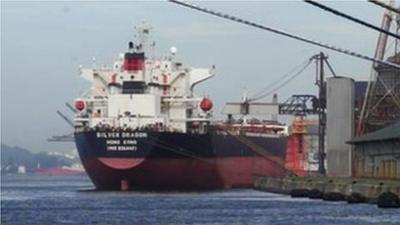 A large ship at the port in Santos