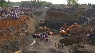 Mechanical diggers at the sight of the mine collapse in Colombia