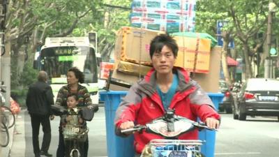 Man delivering parcels in China