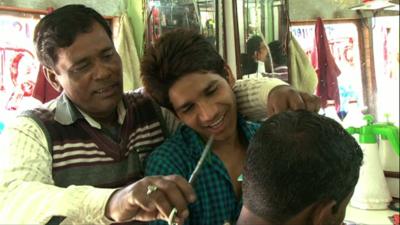 Indian barber Abdul Hameed with his son