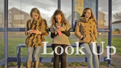 Three women at bus stop