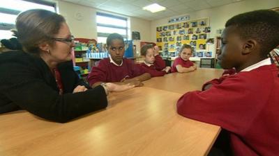 Children playing rock paper scissors