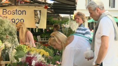 People at flower stall