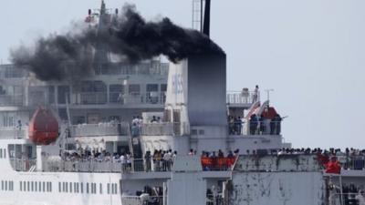 Chinese workers aboard a ship leave Vung Ang port, Ha Tinh province, Vietnam Monday