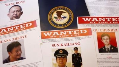 Press materials are displayed on a table of the Justice Department in Washington 19 May 2014