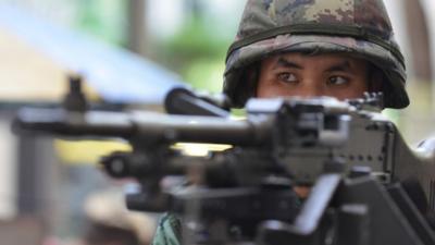 Thai army soldier stands guard on a city centre street after martial law was declared, Bangkok, Thailand, 20 May 2014