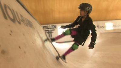 A girl skateboarding in Skateistan in Mazar-e-Sharif