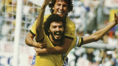 Zico and Socrates celebrate Brazil scoring against Italy at World Cup 1982.