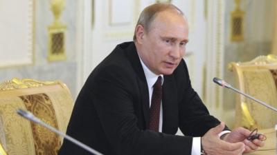 Russia's President Vladimir Putin meets with a group of foreign journalists on the sidelines of the St. Petersburg International Economic Forum 2014