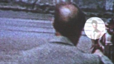 A close-up of the film footage with Dylan Thomas circled