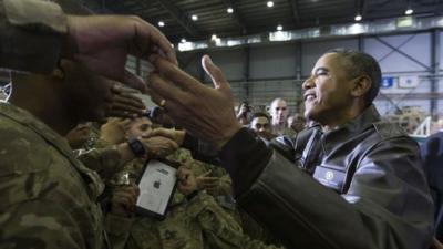 President Barack Obama shakes hands at a troop rally at Bagram Air Field, north of Kabul, Afghanistan, during an unannounced visit, on Sunday, May 25, 2014