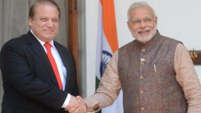 India"s newly sworn-in Prime Minister Narendra Modi (R) shakes hands with Pakistani Prime Minister Nawaz Sharif during a meeting in New Delhi on May 27, 2014.