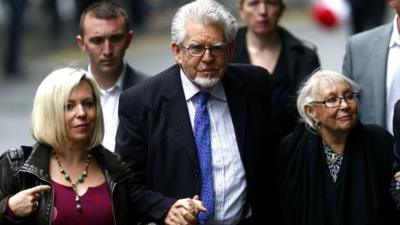 Rolf Harris arrives with his wife Alwen Hughes (right) and his daughter Bindi at Southwark Crown Court in London, 27 May