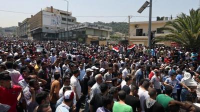 Syrians outside the Syrian embassy in Beirut