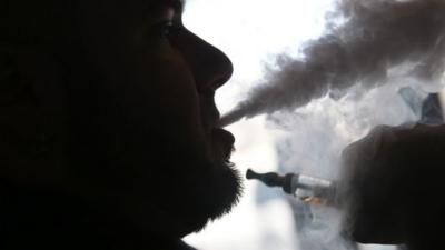 Smoker using e-cigarette