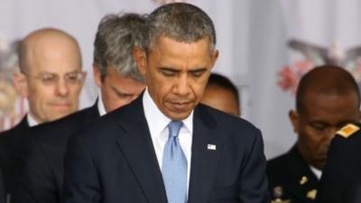 U.S. President Barack Obama pauses for the invocation before giving the commencement address at the graduation ceremony at the U.S. Military Academy at West Point on May 28, 2014 in West Point, New York