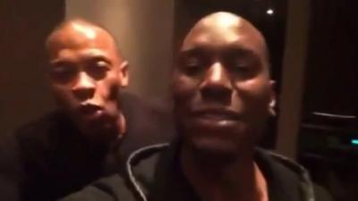 Still from video posted online shows Dr Dre (left) celebrating Apple deal