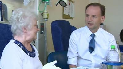 NHS chief executive Simon Stevens with a patient