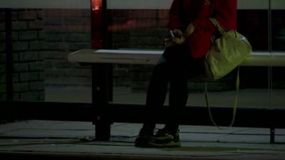 Anonymous girl at bus stop