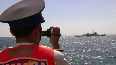 Man films ship in South China Sea