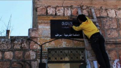 Man putting up sign