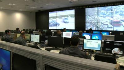 Computer monitors inside a security centre in Brazil