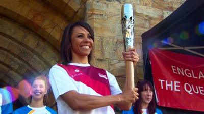 Dame Kelly Holmes with the Queen's Baton