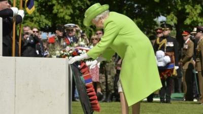 The Queen lays a wreath at Bayeux War Cemetery