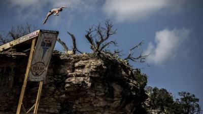 Diver Dave Hunt jumps off a diving board