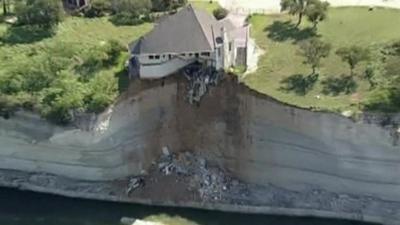 House hanging over a cliff