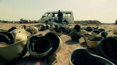 Abandoned Iraqi army helmets