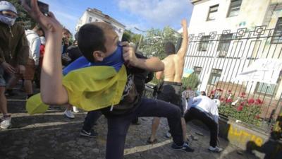 Protesters throw objects