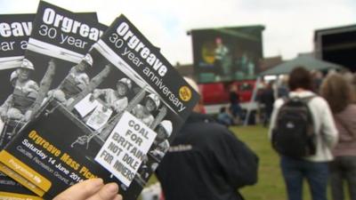 Orgreave flyer with people facing a music stage in the background