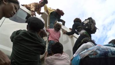 Workers climbing into truck