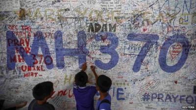 Children in front of MH370 prayer wall