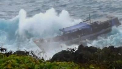 Ship next to Christmas Island coastline