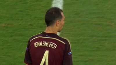 Russia's Sergei Ignashevich hits a free-kick from range