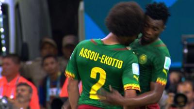 Cameroon team-mates Benoit Assou-Ekotto and Ben Moukandjo square up to each other