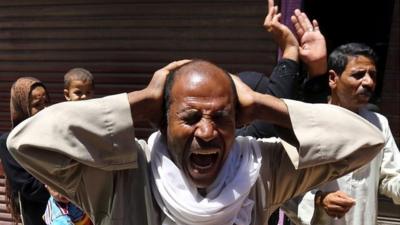 Relatives of Muslim Brotherhood members and supporters of Mohamed Mursi react outside court