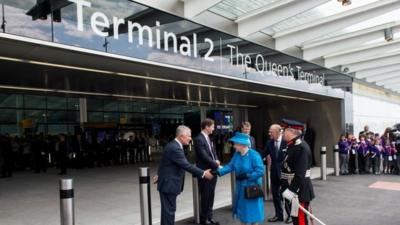 Queen Elizabeth II and Prince Philip, Duke of Edinburgh are greeted by Nigel Rudd, Chairman of London Heathrow, John Holland-Kaye Heathrow Development Director and Colin Matthews,