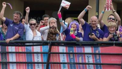 People cheering the arrival of the Clipper race on the River Foyle