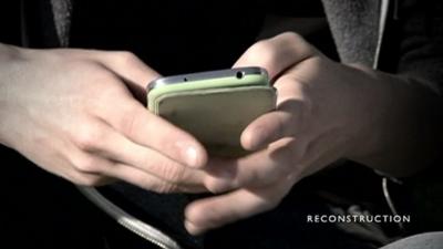 Boy holding phone