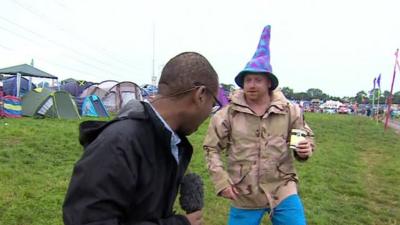 The BBC's Lizo Mzimba talks with a Glastonbury reveller